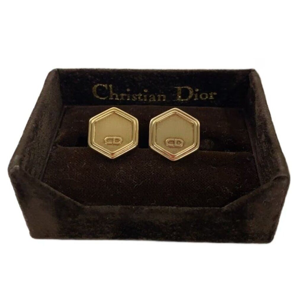 vintage Christian Dior gold-tone hexagonal cufflinks with the 'CD' logo, present
